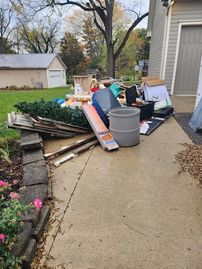 Dumpster being loaded with debris for 12 Yard Dumpster Rental in Rancho Calaveras